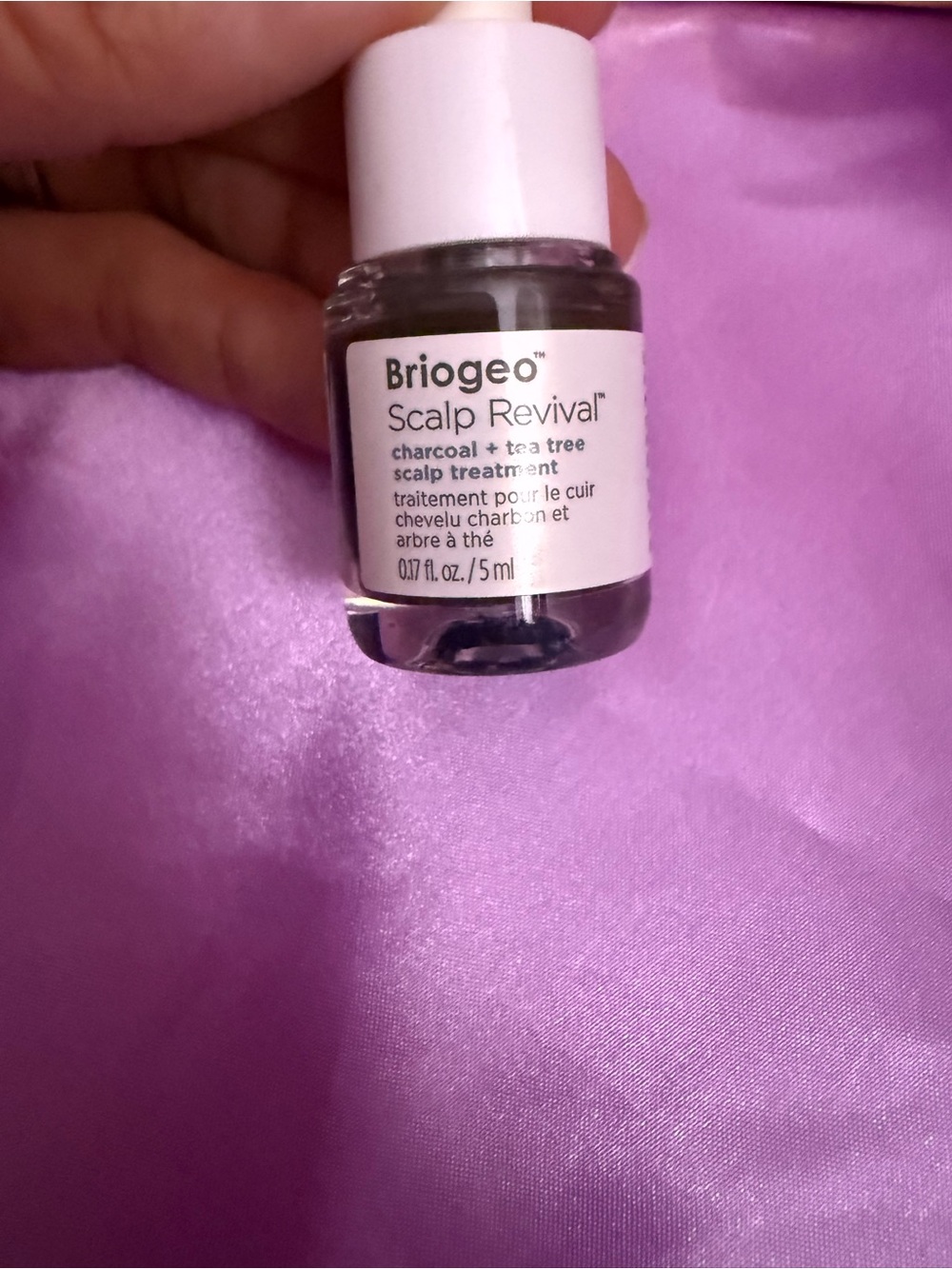 Briogeo Scalp Revival Serum in White and Pink Packaging on Purple Backing